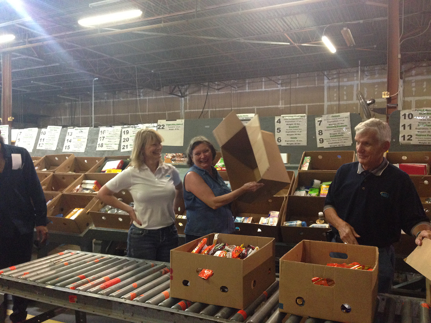 VIBE team members sorting items at Feeding Tampa Bay