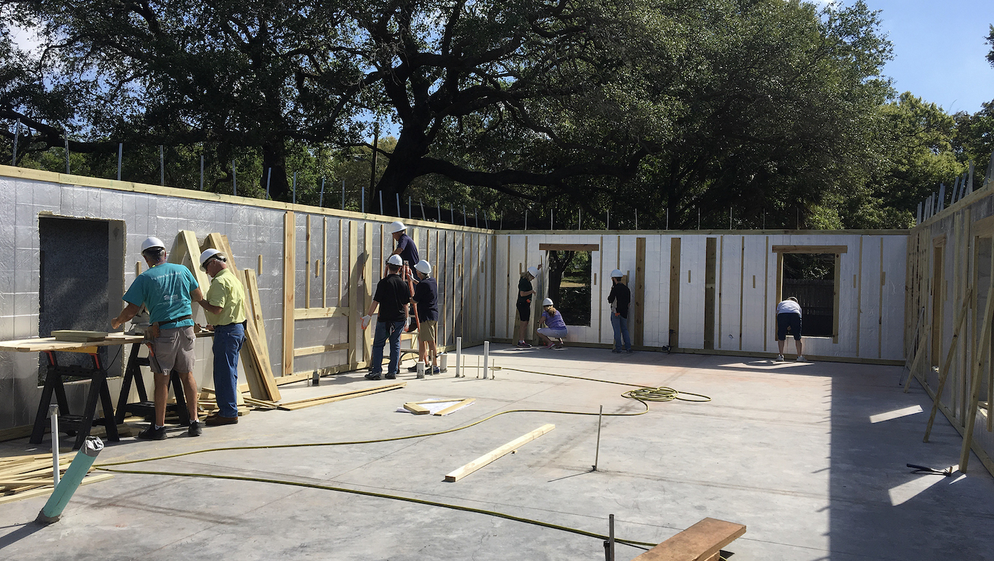 VIBE team members constructing walls for a Habitat for Humanity home