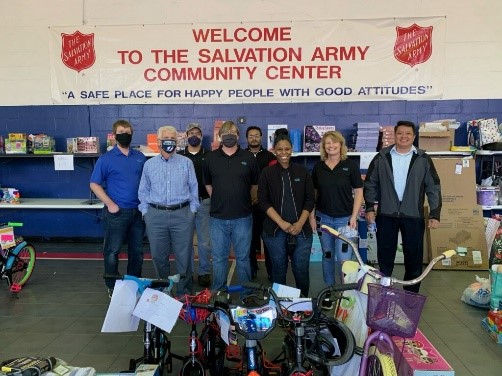 VIBE team during the 2020 Salvation Army Toy Sorting with team members standing with bicycles